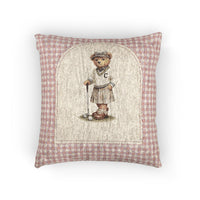 Baby woven pillow with a golfing teddy bear on a pink gingham border, front view