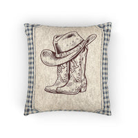 Baby woven pillow with a cowboy hat and boots on a cream panel with a blue gingham border, front view