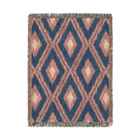 Boho Aztec woven blanket in navy and cream with rust Aztec motifs, shown flat