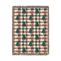 Christmas tree plaid woven blanket featuring dark green tree motifs on a rust and cream buffalo-check pattern