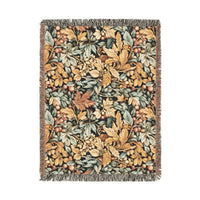William Morris style fall woven blanket with gold and sage leaves and coral berries on a dark ground