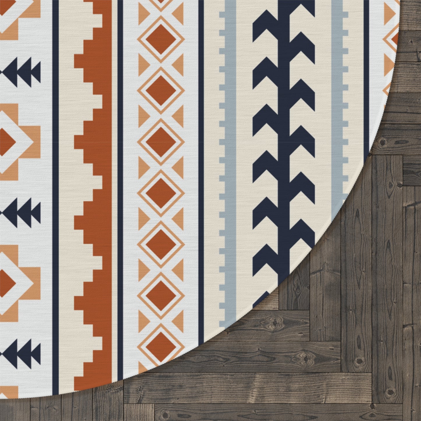 Close-up of the Mexican Boho round rug edge showing the pattern against a dark wood floor