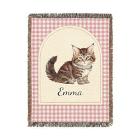 Personalized woven baby blanket with a tabby cat and a name on a pink gingham border, shown flat