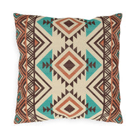 Rust and teal Aztec diamond outdoor pillow in cream with turquoise and rust diamonds, front view