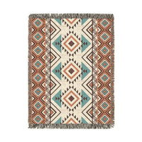 Rust and teal Aztec diamond woven blanket with concentric diamonds in navy, rust and cream, shown flat