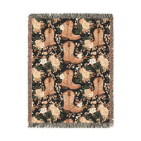 Western woven blanket with brown cowboy boots, peach roses and green leaves on black, shown flat