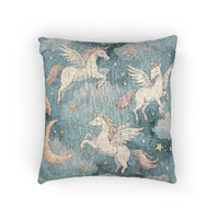Woven pillow with cream winged unicorns, crescent moons and stars on a teal blue ground, front view