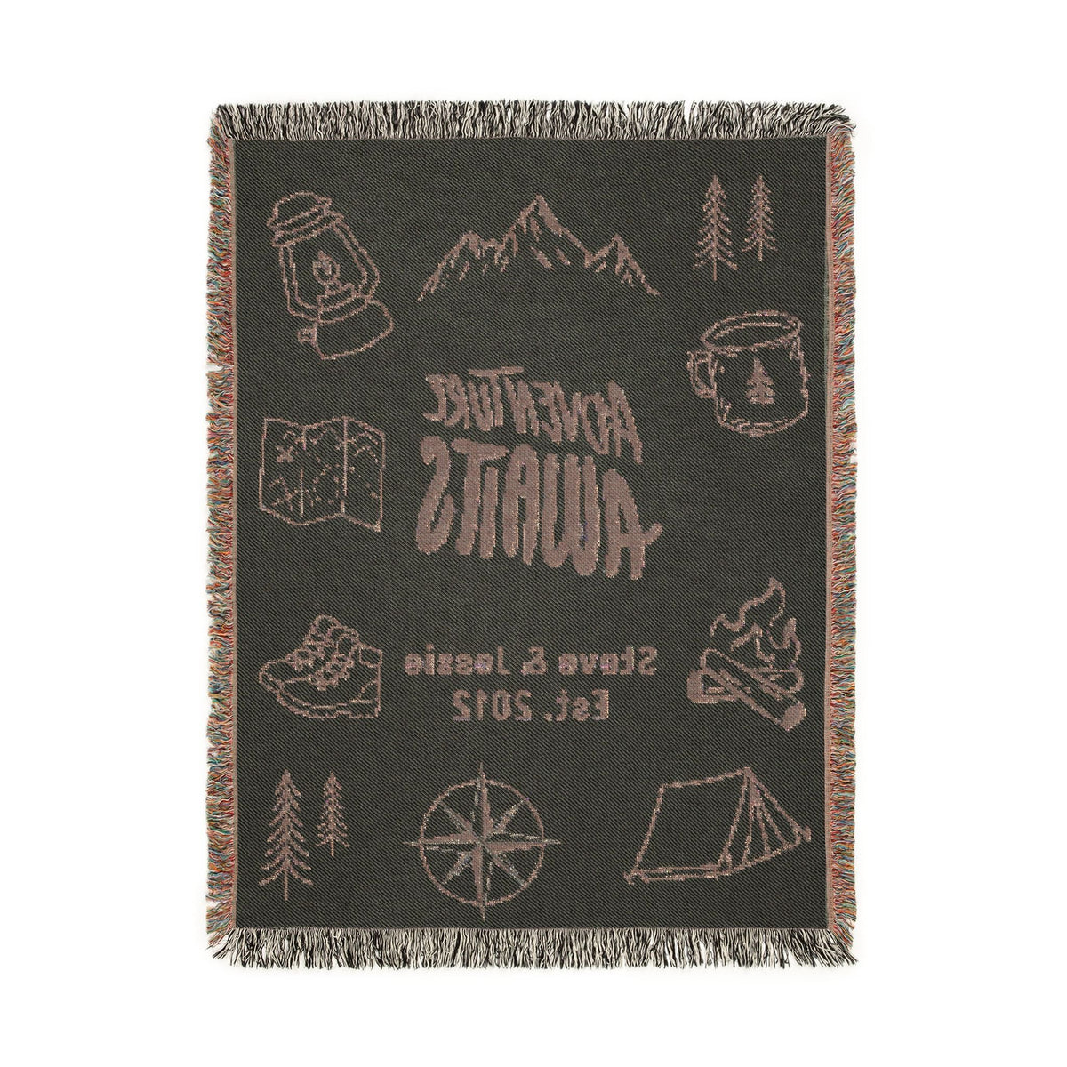 Back side of the Adventure Awaits personalized woven blanket, showing the design in reversed colors with light graphics on a dark charcoal ground