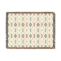 Boho Arrow woven blanket with terracotta and teal feathers, fine black arrows and diamond medallions on cream, shown flat