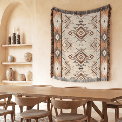 Boho Aztec woven blanket over a bench in a dining room with a wooden table