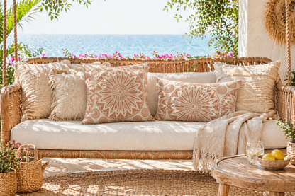 Mandala outdoor rug on a seaside terrace with cushions on a garden sofa