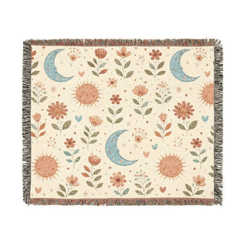 Boho Sun Moon woven blanket in cream with rust suns, blue crescent moons and florals, shown flat