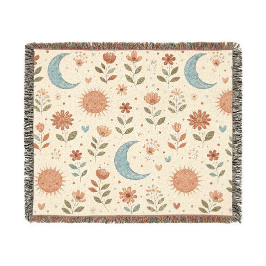 Boho Sun Moon woven blanket in cream with rust suns, blue crescent moons and florals, shown flat