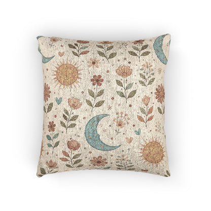 Boho woven pillow with rust suns, blue crescent moons and small florals on cream, front view