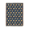 Celestial Boho woven blanket in navy with gold suns, moons and stars, shown flat