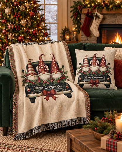 Christmas woven blanket and matching woven pillow featuring three gnomes riding in a vintage truck bed, styled together