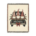 Christmas woven blanket featuring three gnomes riding in a vintage truck bed with holly, berries and a Merry Christmas message