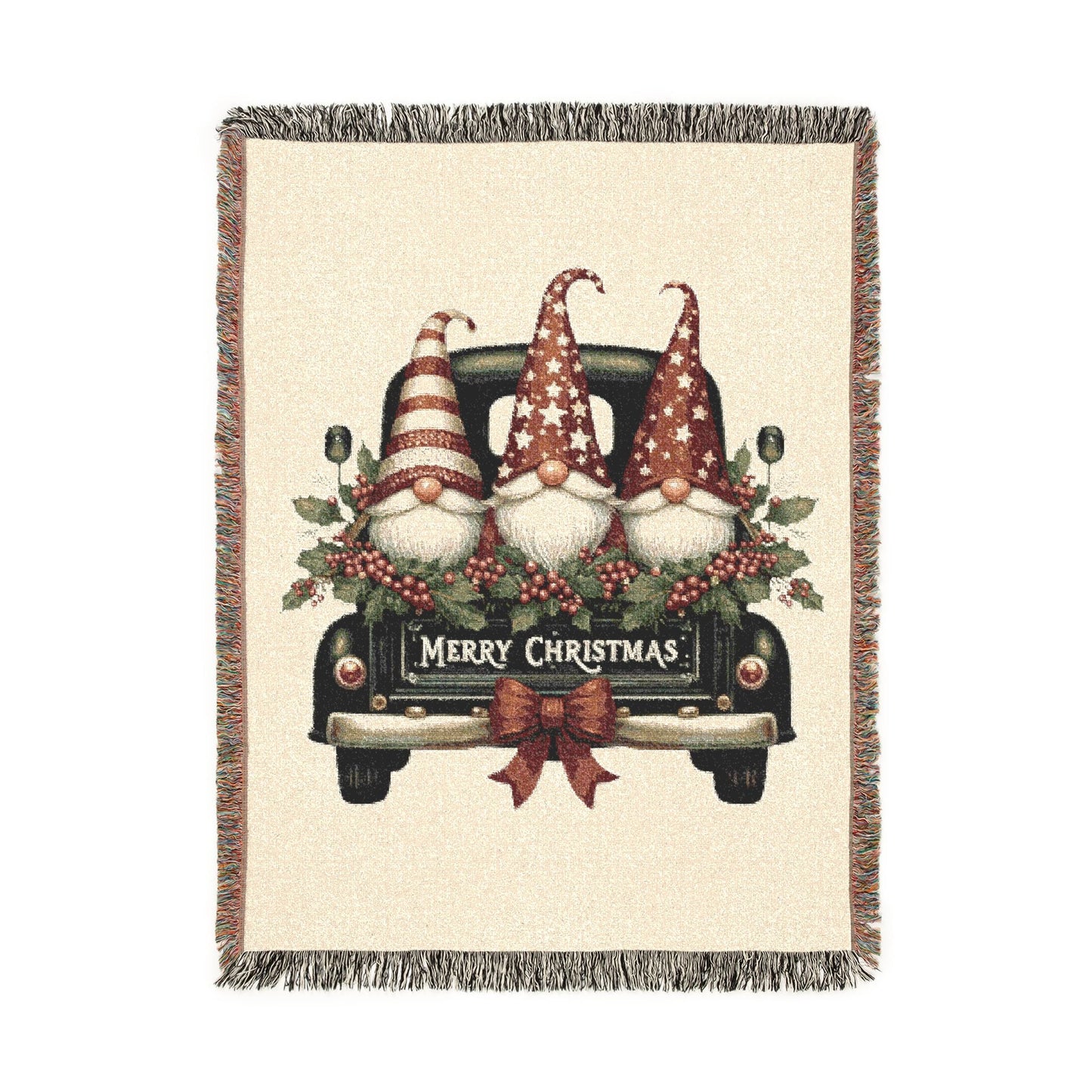 Christmas woven blanket featuring three gnomes riding in a vintage truck bed with holly, berries and a Merry Christmas message