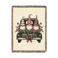 Christmas woven blanket featuring three gnomes riding in a vintage truck bed with holly, berries and a Merry Christmas message