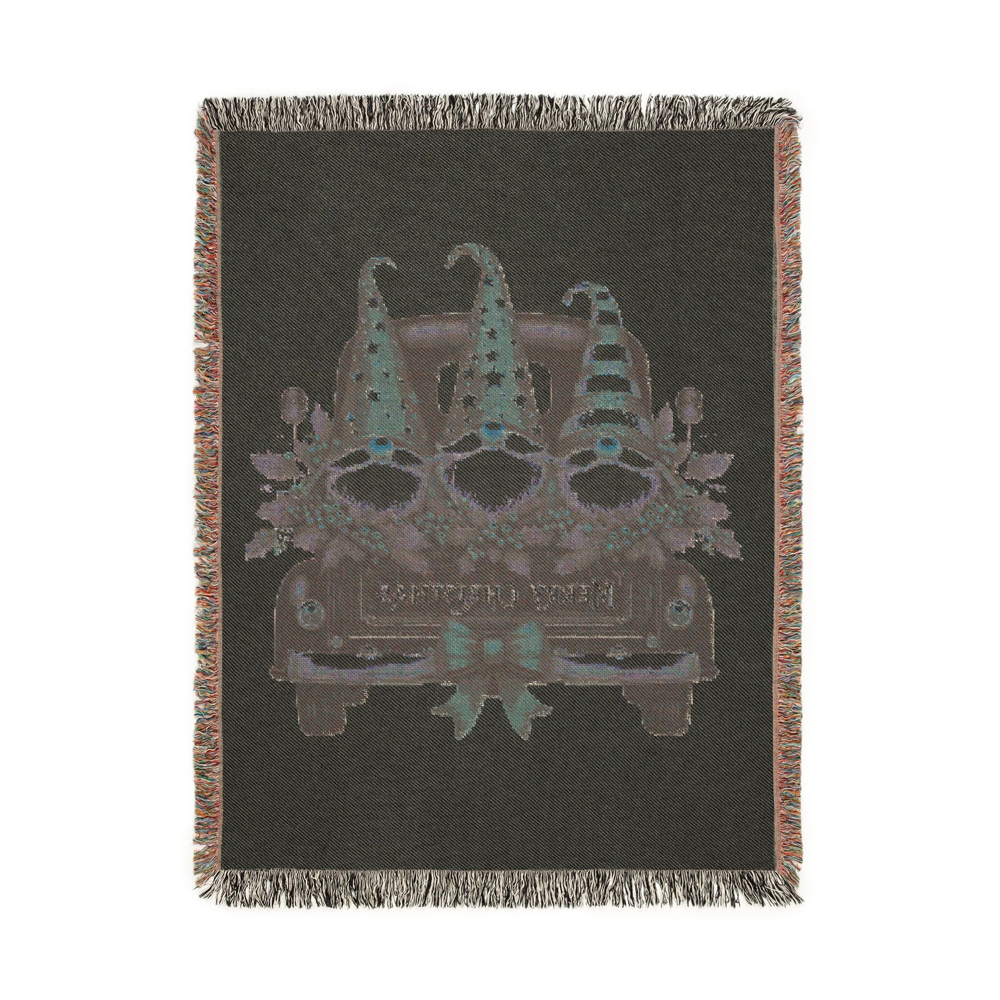 Christmas woven blanket featuring three gnomes riding in a vintage truck bed with holly, berries and a Merry Christmas message