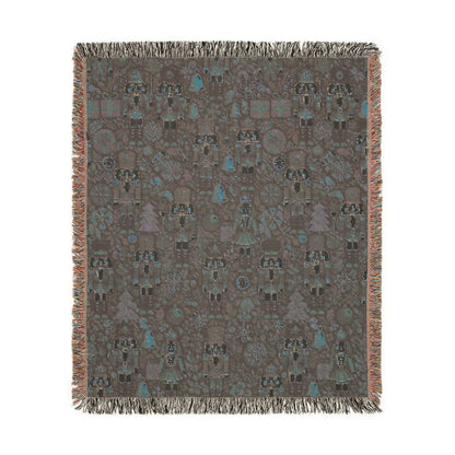 Reverse side of the Christmas nutcracker woven blanket in muted grey