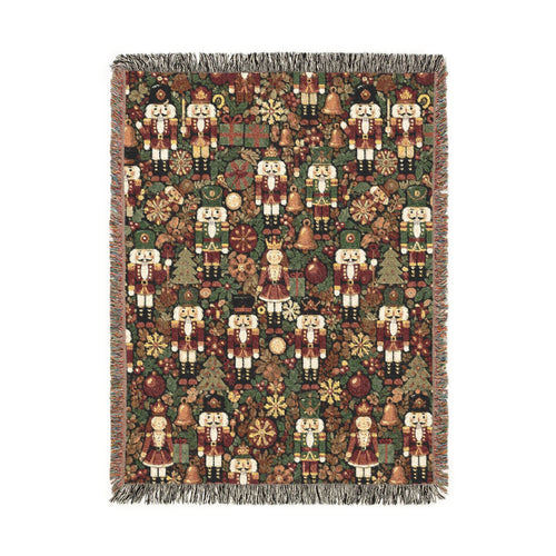 Christmas woven blanket with nutcrackers, gifts and ornaments on a deep green ground, shown flat