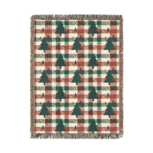 Christmas tree plaid woven blanket featuring dark green tree motifs on a rust and cream buffalo-check pattern