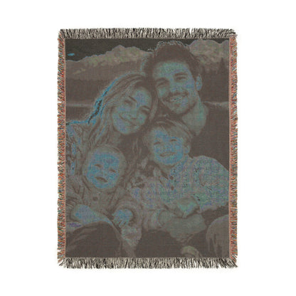 Back side of the custom photo woven blanket, showing the photo in reversed blue and grey tones