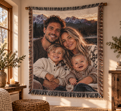 Custom photo woven blanket with a family photo, draped over a sofa in a sunlit living room