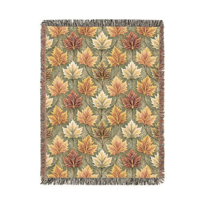 Fall woven blanket with gold, rust and cream maple leaves on sage green, shown flat