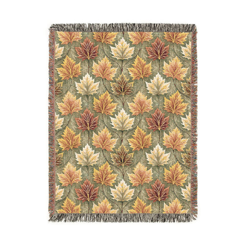 Fall woven blanket with gold, rust and cream maple leaves on sage green, shown flat