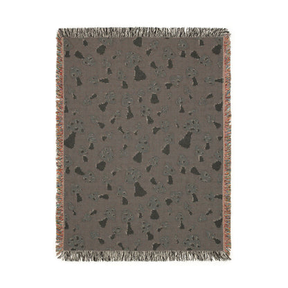 Reverse side of the Mushroom Green woven blanket in muted grey-brown