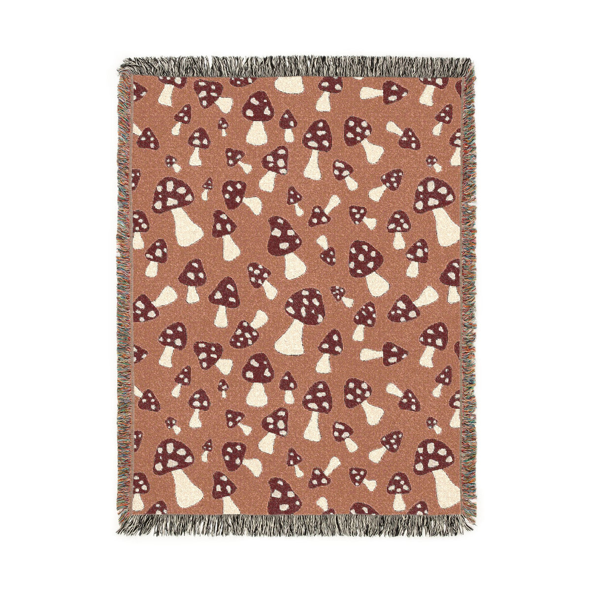 Fall woven blanket with cream and rust toadstools on a warm terracotta ground, shown flat