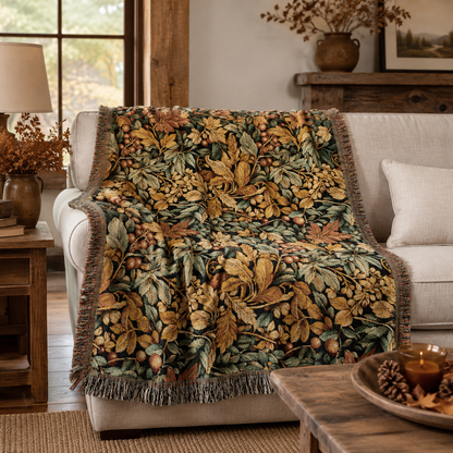 William Morris fall blanket draped over the arm of a cream sofa