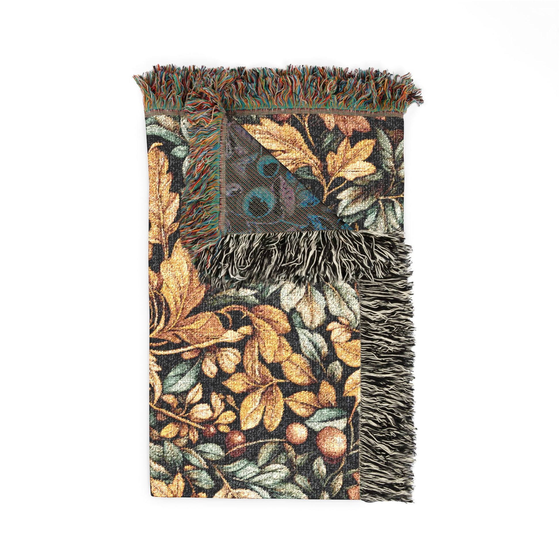 Folded William Morris berry and leaf woven blanket showing the fringed edge and the sage-grey reverse side