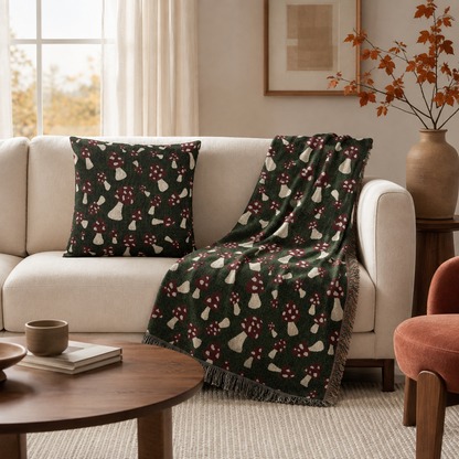 Mushroom Green pillow with a matching throw on a cream sofa