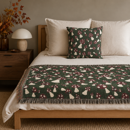 Mushroom pillow and matching blanket on a bed with cream linens