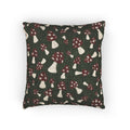 Fall woven pillow with red toadstools and cream spots on deep forest green