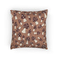 Fall woven pillow with cream and rust mushrooms on a warm brown ground