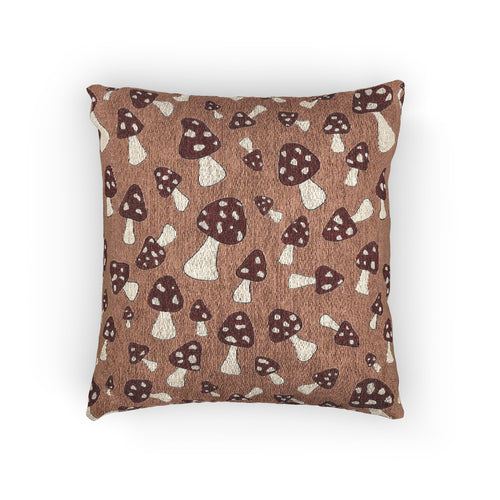 Fall woven pillow with cream and rust mushrooms on a warm brown ground