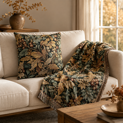 Matching William Morris berry and leaf pillow and blanket on a cream armchair