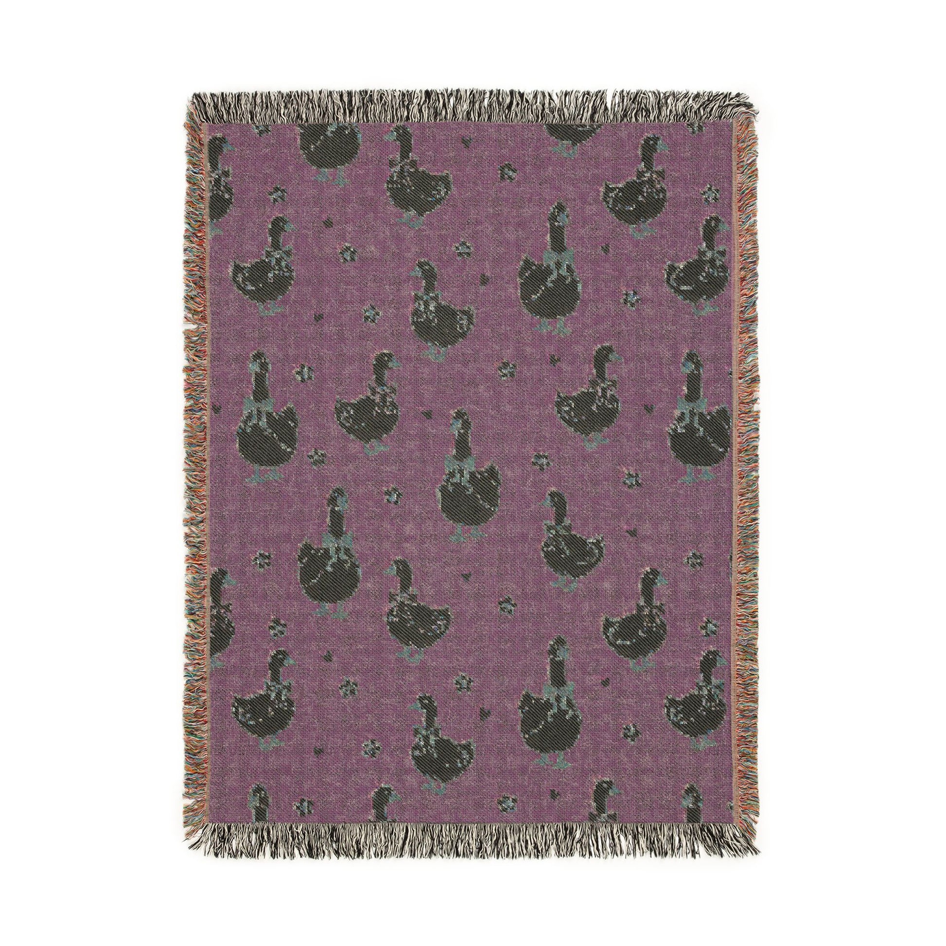 Reverse side of the goose woven blanket in deep plum
