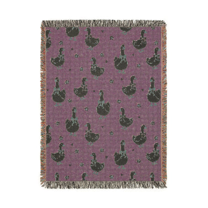 Reverse side of the goose woven blanket in deep plum