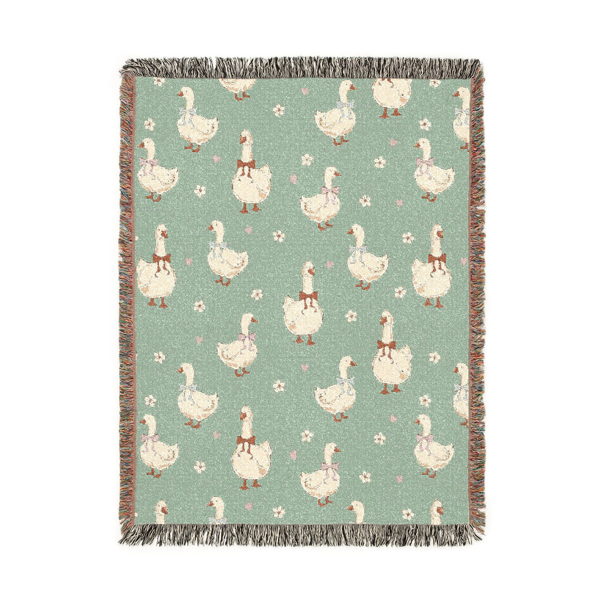 Sage green woven blanket with cream geese wearing rust, lilac and blue bows, with small daisies, shown flat