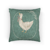 Woven pillow with cream geese in rust, lilac and blue bows and small daisies on sage green, front view