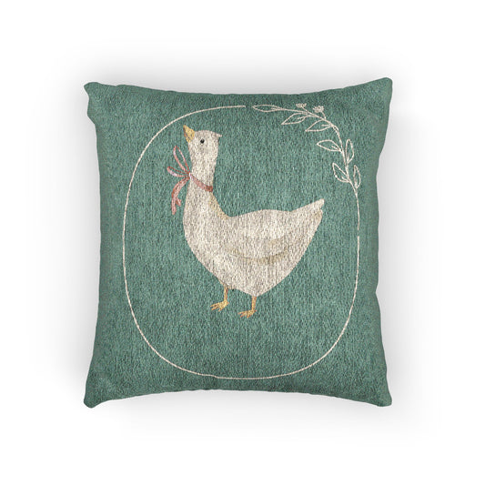 Woven pillow with cream geese in rust, lilac and blue bows and small daisies on sage green, front view