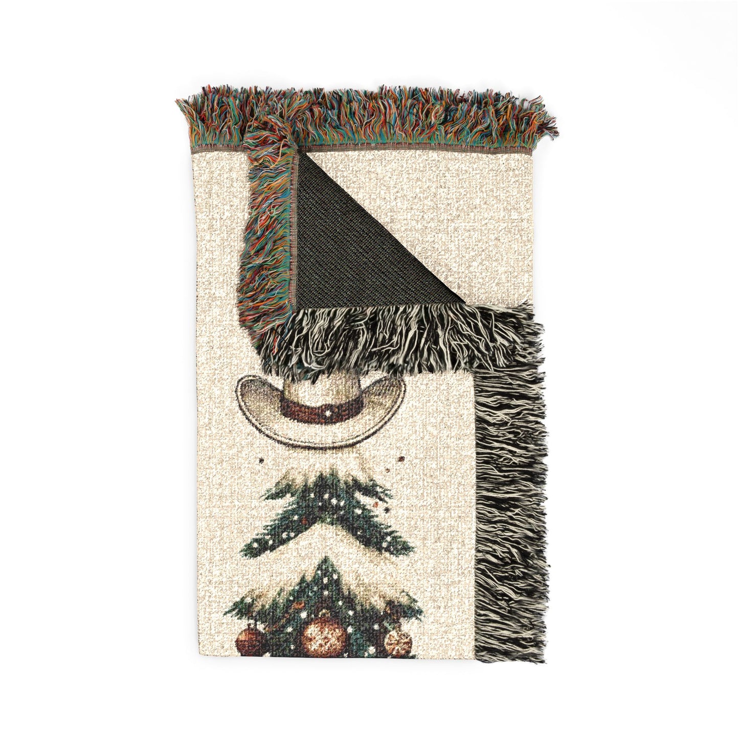 Close-up of the woven texture and fringed edge of the Howdy Christmas blanket