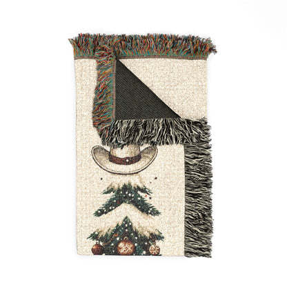 Close-up of the woven texture and fringed edge of the Howdy Christmas blanket