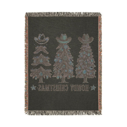 Reverse side of the Howdy Christmas woven blanket showing the inverted cowboy tree pattern