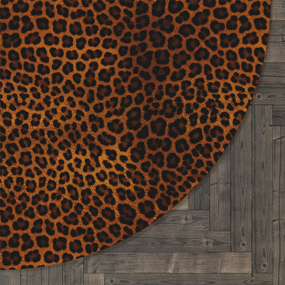 Close-up of the Leopard round rug edge against a dark wood floor